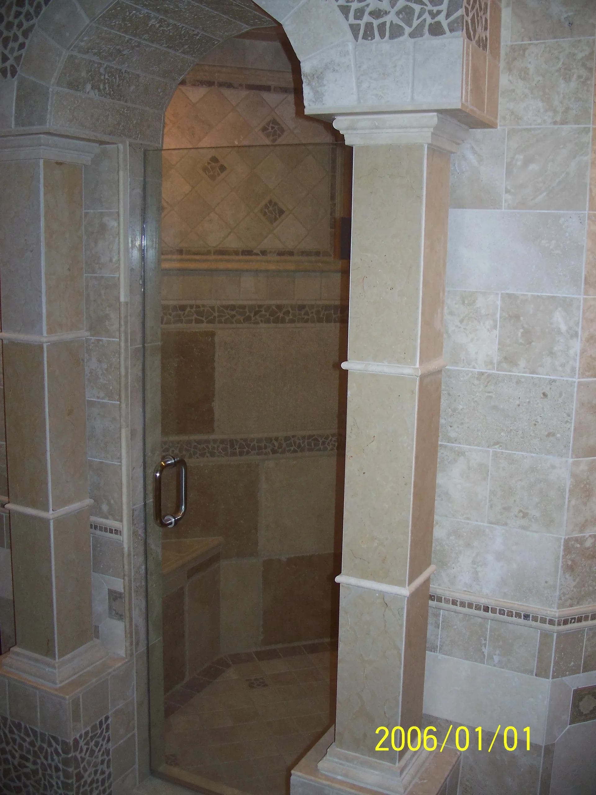 Master Bath - Main shower view of custom bath with natural stone, custom columns and custom header