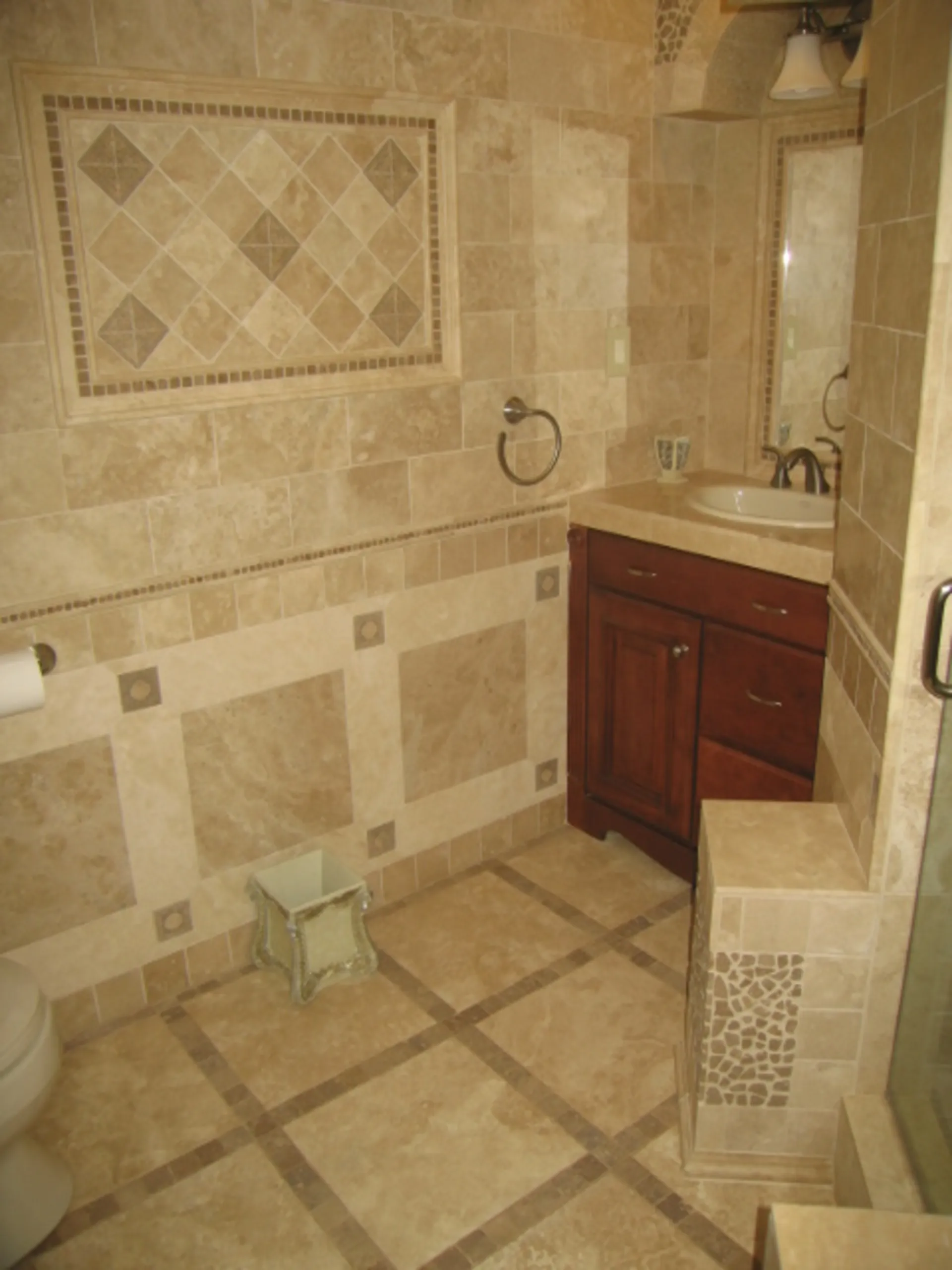 Master Bath - Alternate wide view of custom bath with natural stone, featuring tile inlay outside shower, custom tile mirror surrounds, and custom tile vanity tops