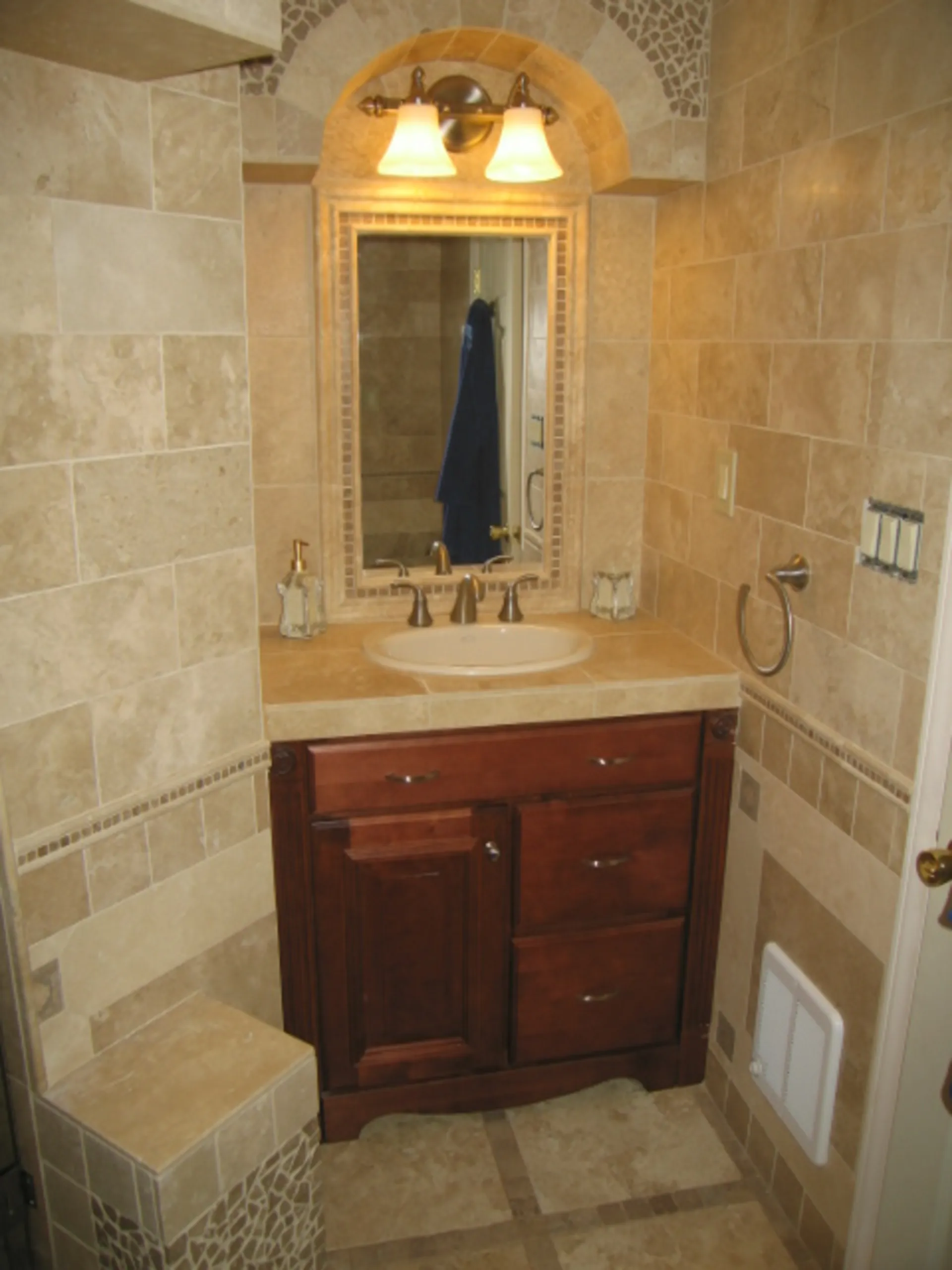 Master Bath - First vanity view of custom bath with natural stone, dual vanity, custom tile mirror surrounds, and custom tile vanity tops