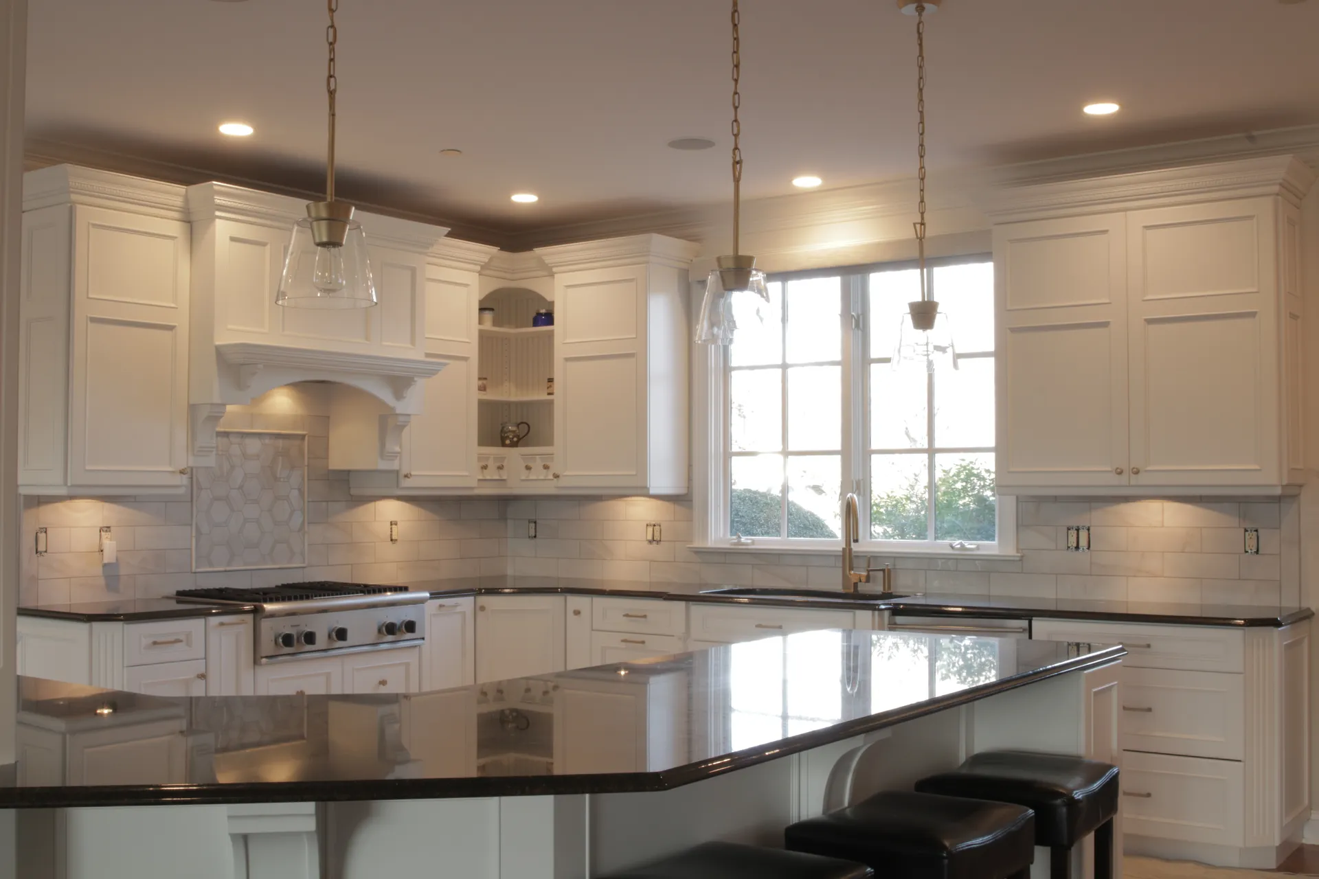 Kitchen - Wide view of granite countertop, custom kitchen island, tile inlay, custom cabinets