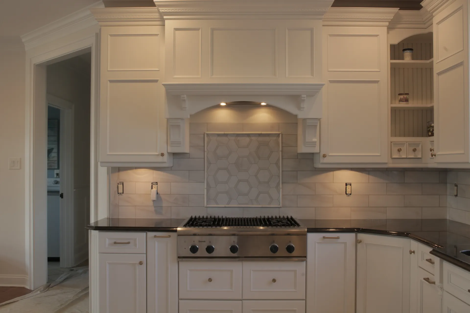 Kitchen - Close-up view of custom cabinets and stovetop