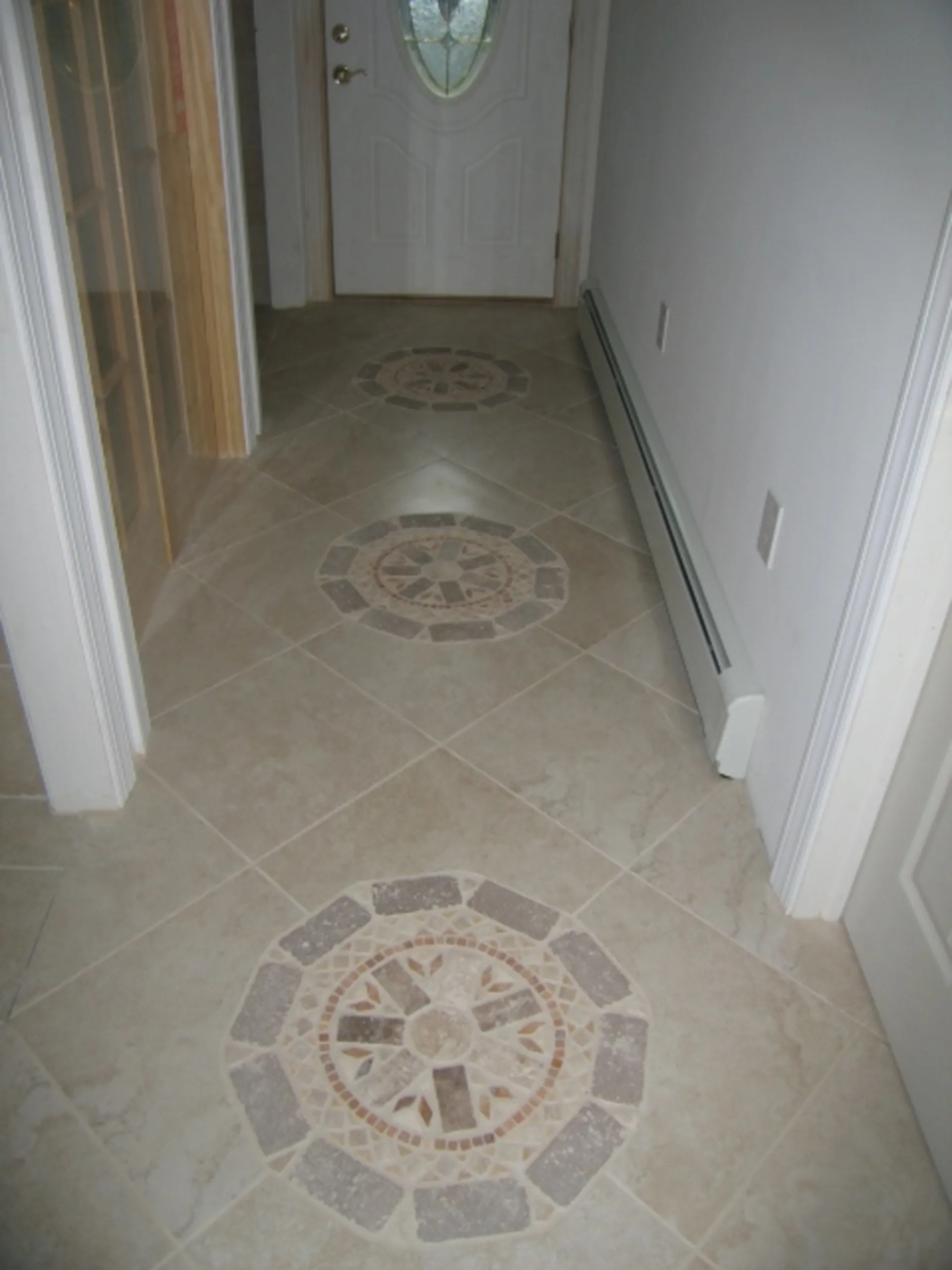 Foyer - Main view of handcrafted circular tile inlay inside foyer
