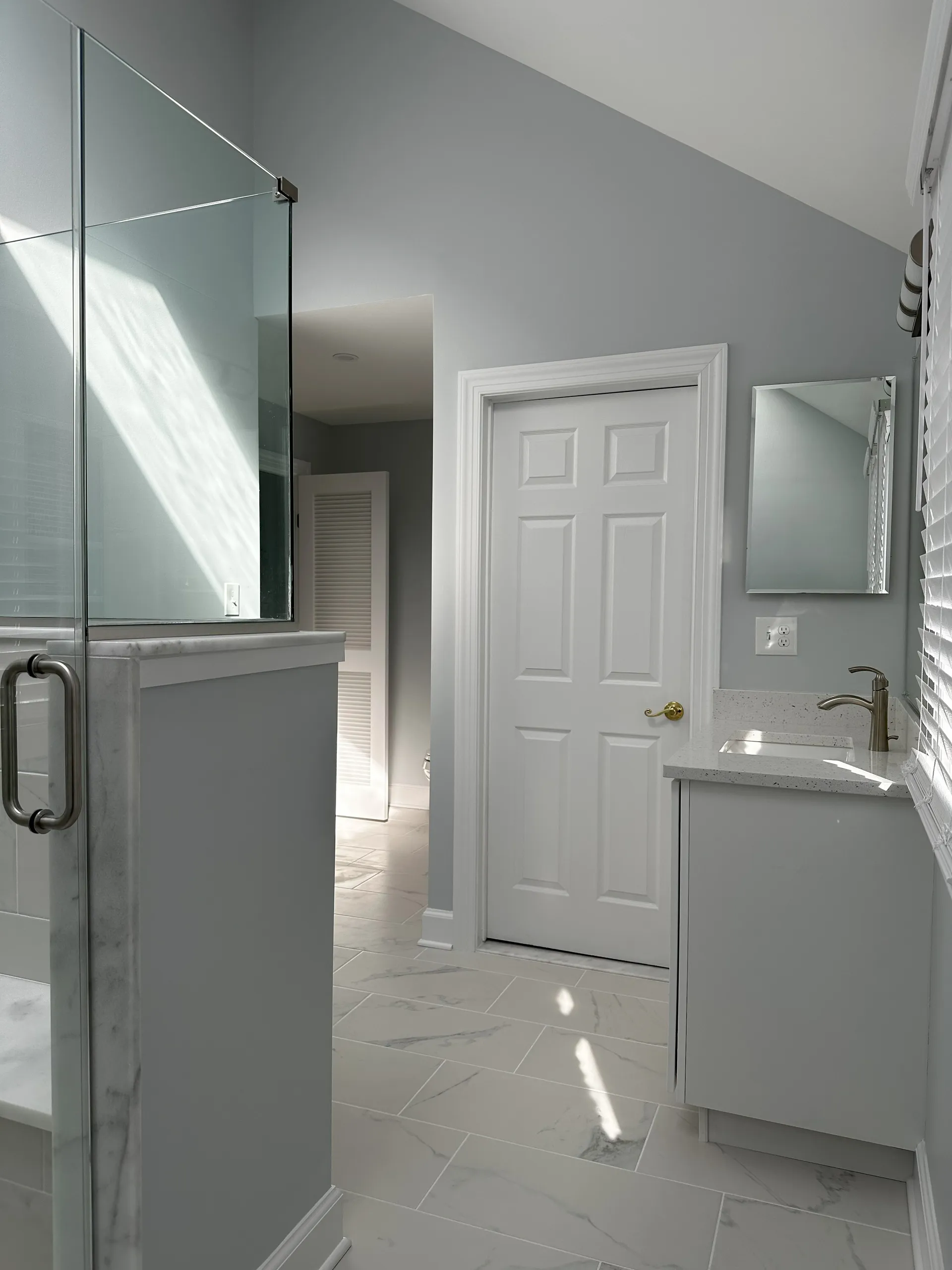 Master Bath - Large format floor tile with modern vanity and wash area