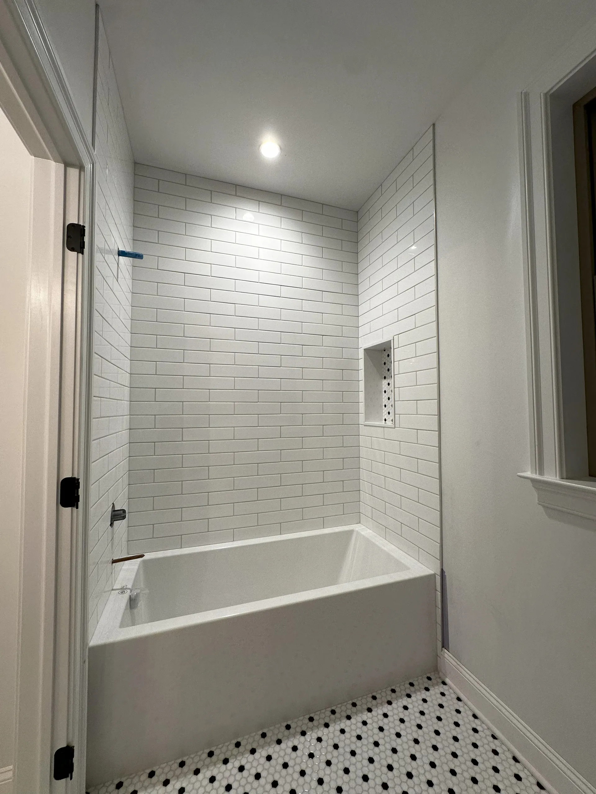 Hall Bath - Full view of bathtub and custom niche